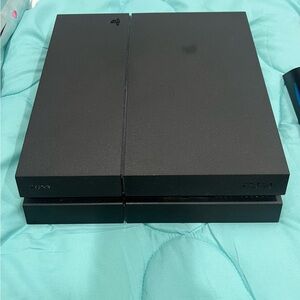 PlayStation 4 with one controller and vertical stand with cooling fan